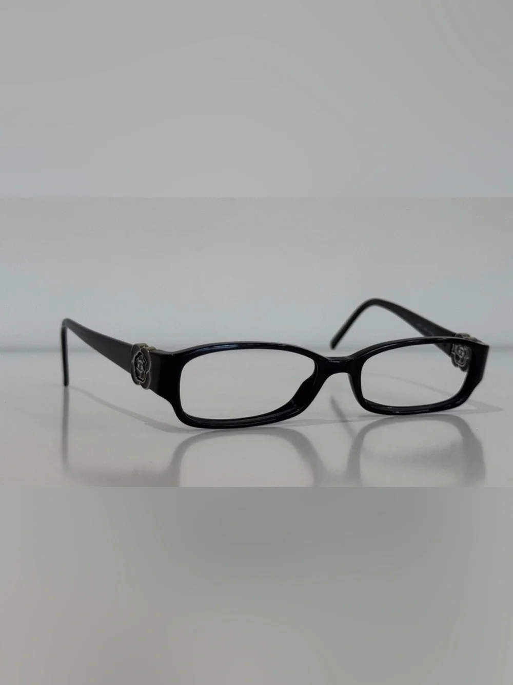 CHANEL Frame Black Rectangular Glasses with Camellia Temple Accent